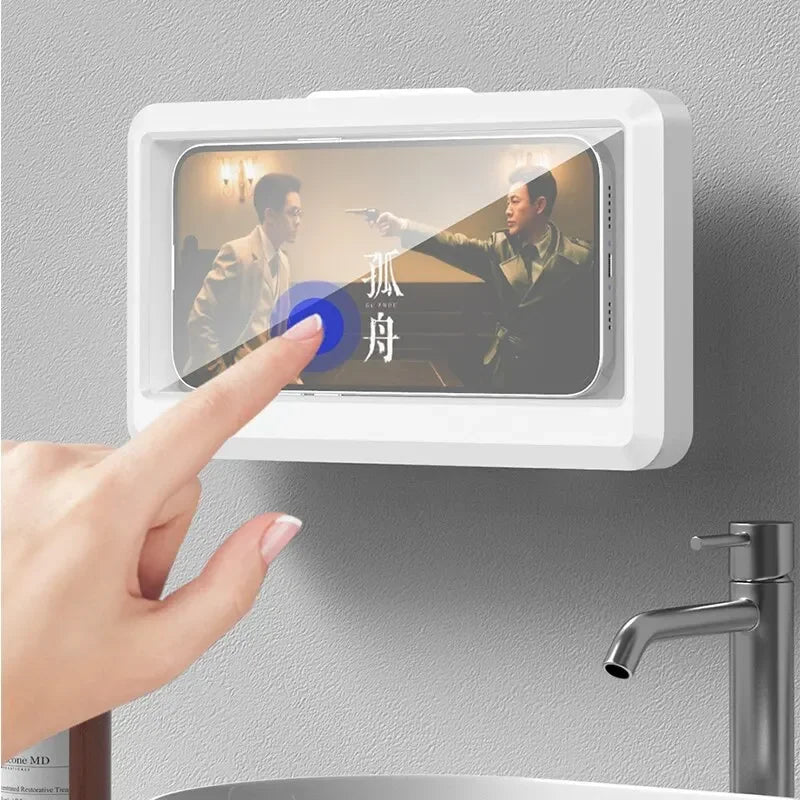 Hand pressing a digital display on a wall with a sink in the background