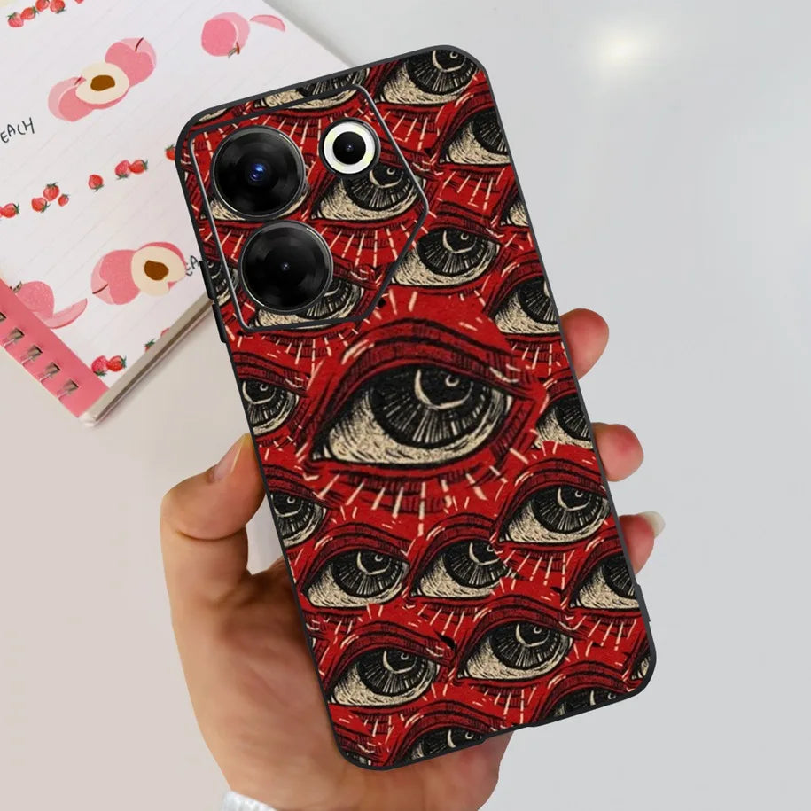 Phone case with eye pattern held by a hand on a light background