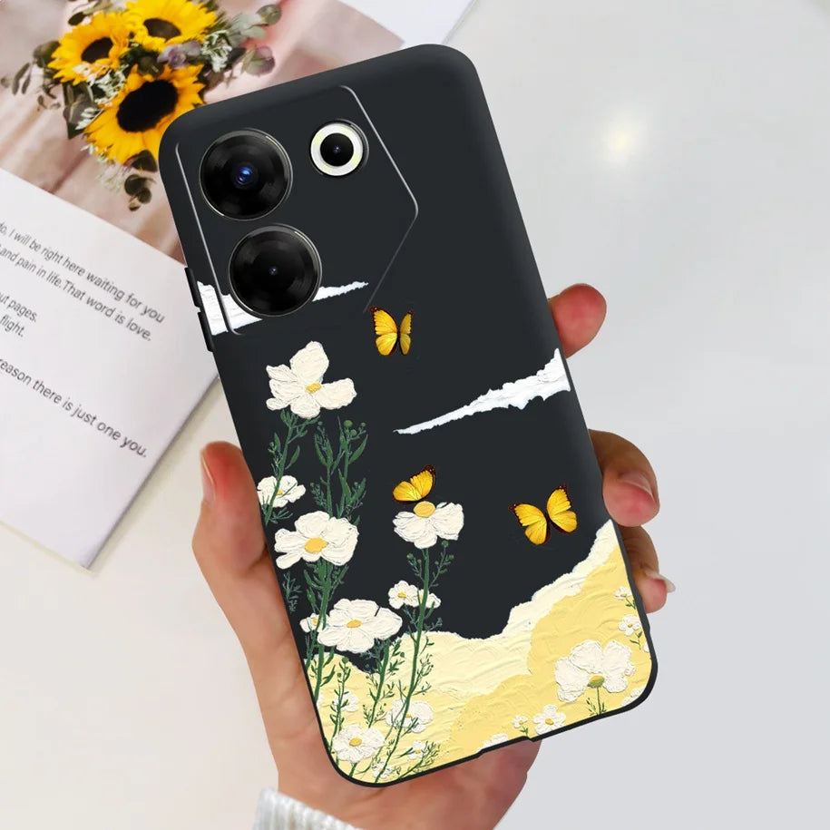 Phone case with floral and butterfly design held by a hand