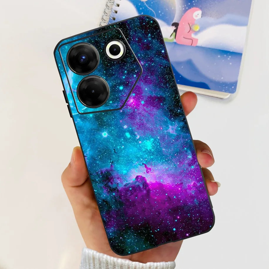 Hand holding a phone with a galaxy-themed case against a light background